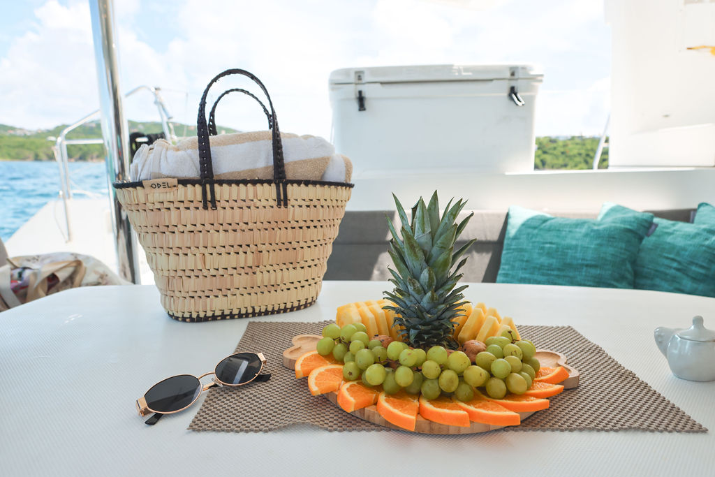 Fresh fruit platter and beach basket aboard a charter boat